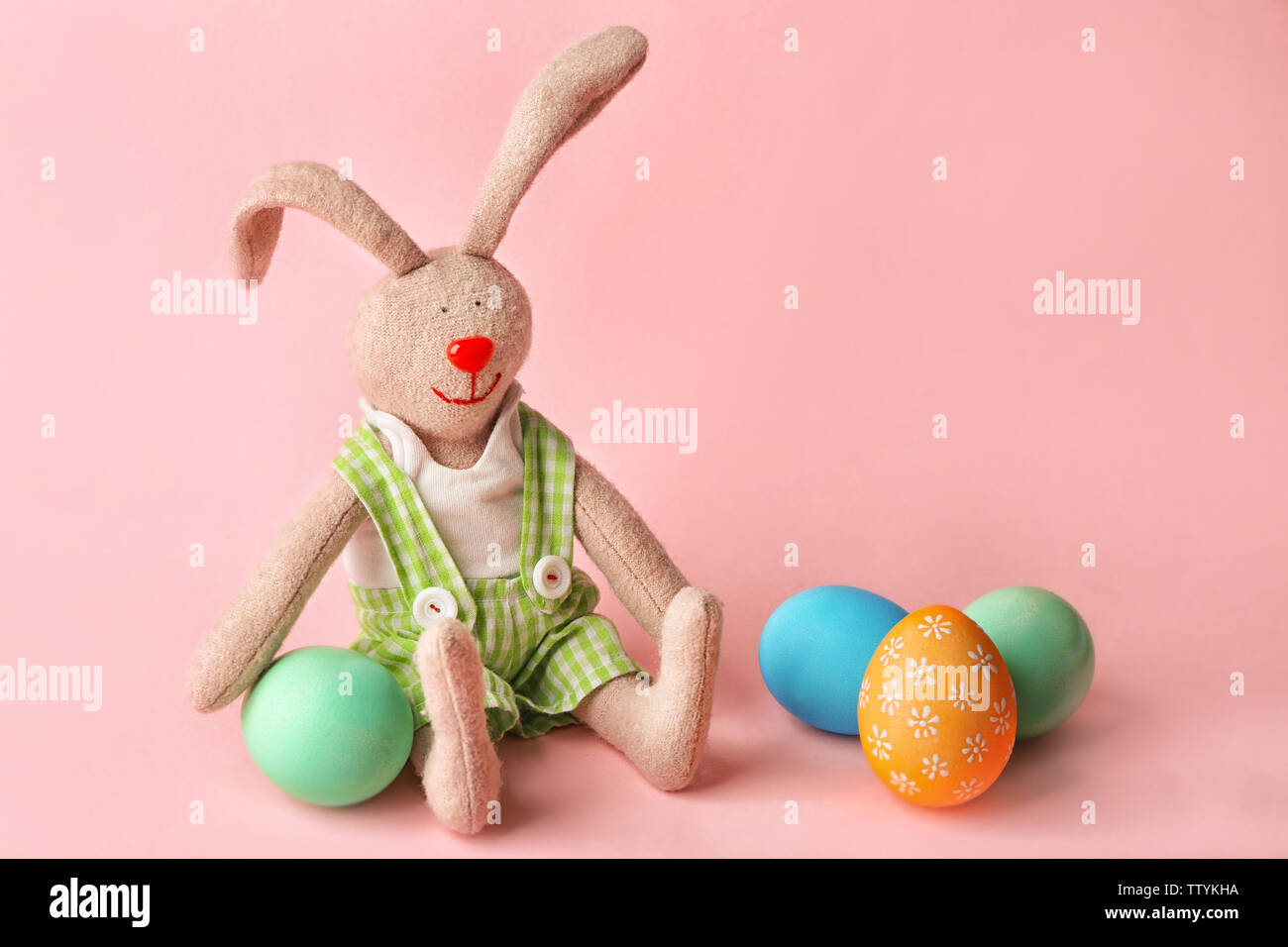 Colorful Easter eggs and bunny on pink background Stock Photo Alamy