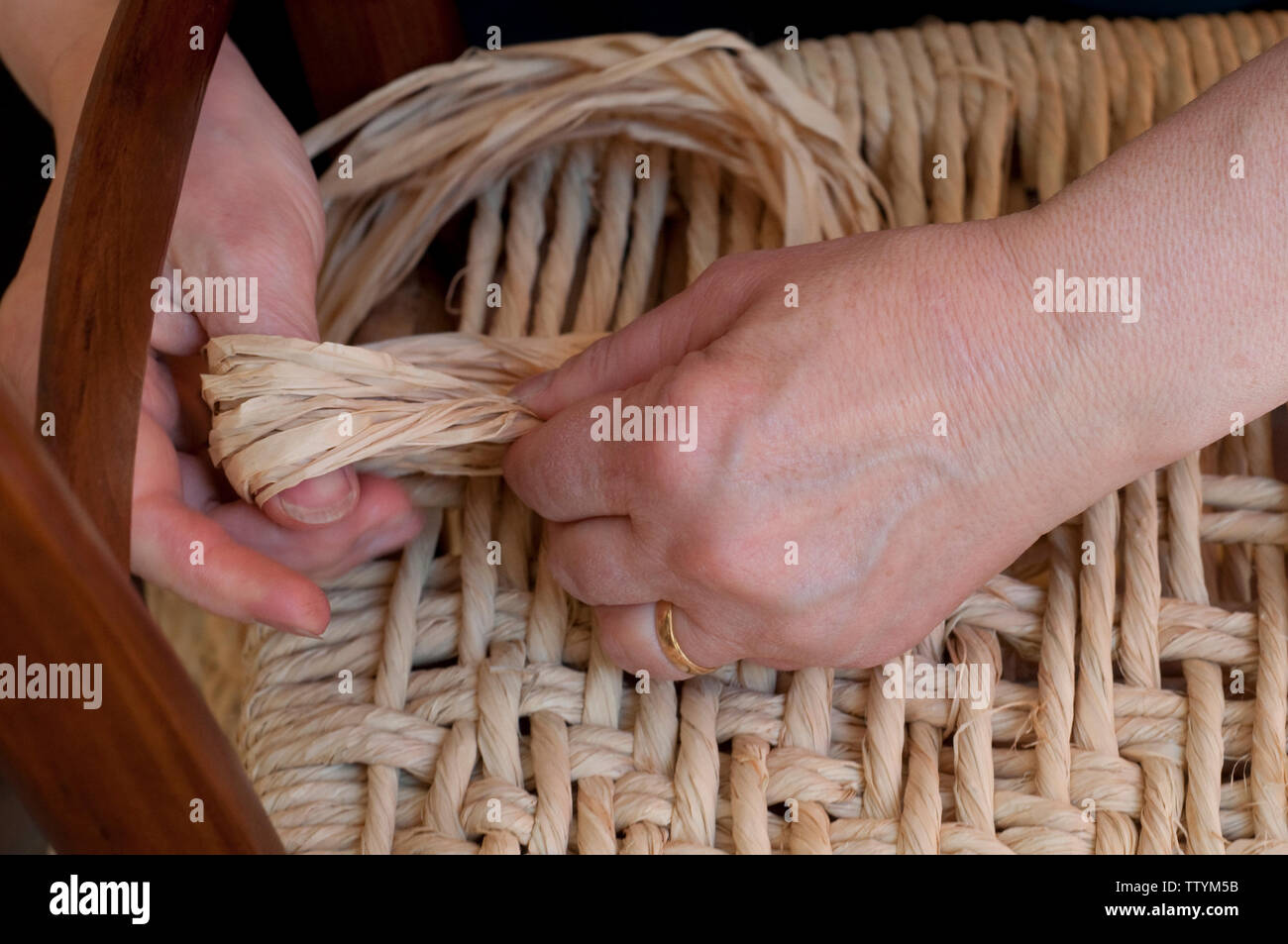 Italy, Emilia Romagna, ChairMender bottoming a Chair with a Straw