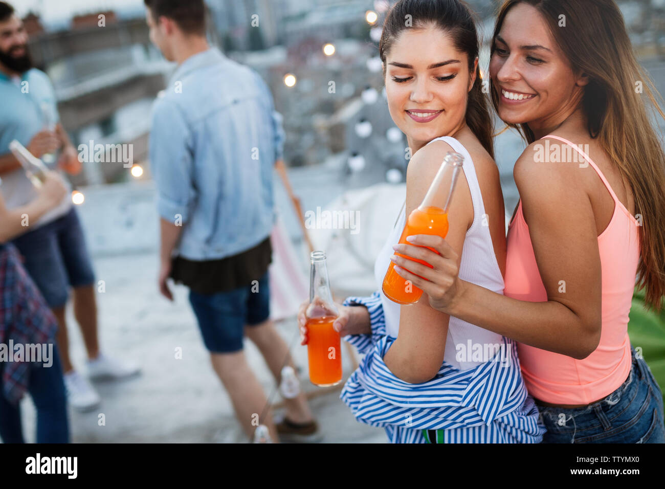 Happy young girls having fun at party Stock Photo - Alamy