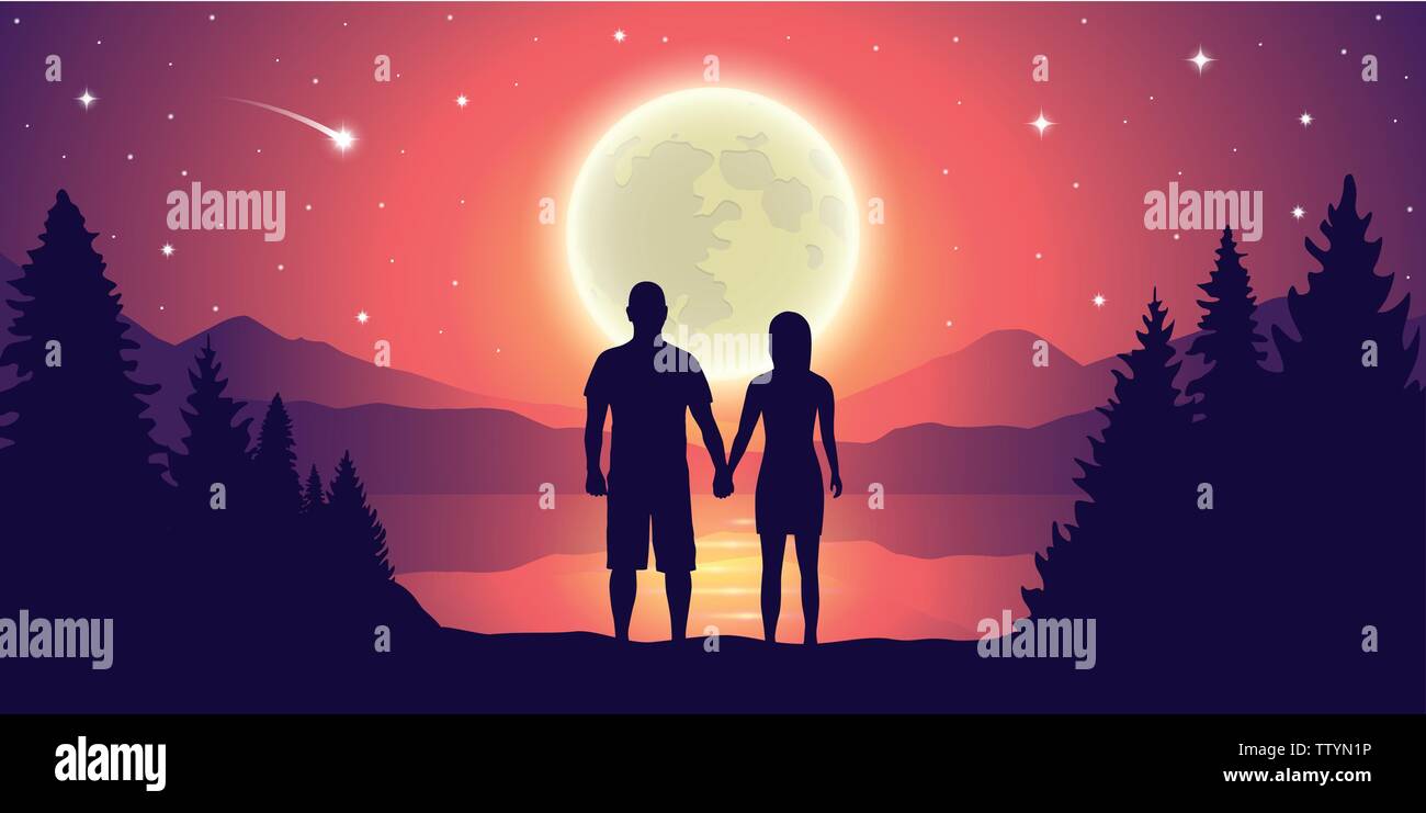couple looks to the full moon and falling stars at beautiful lake ...
