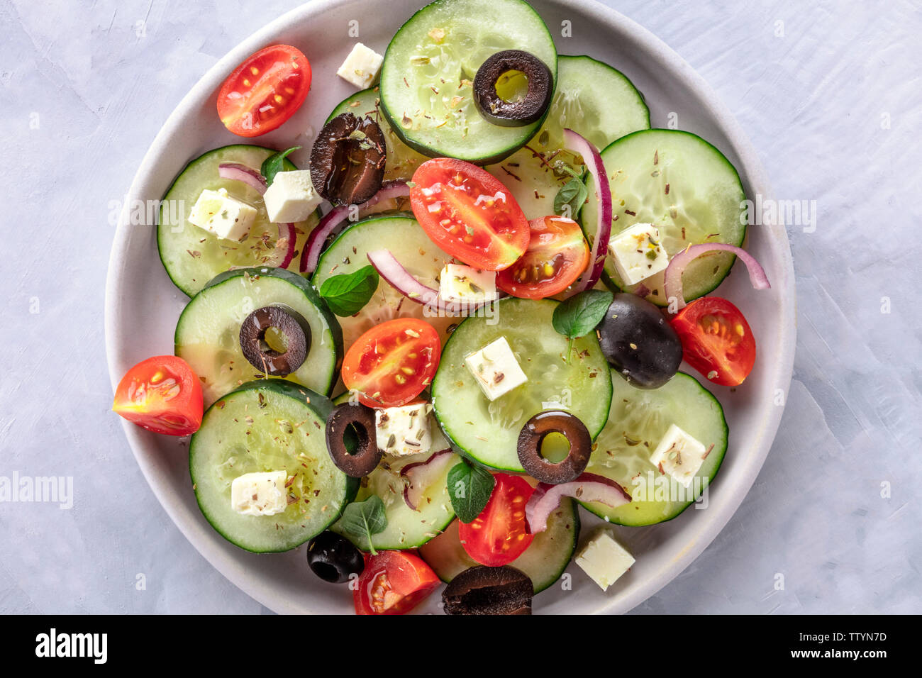 Greek salad, an overhead closeup photo. Fresh salad with feta cheese