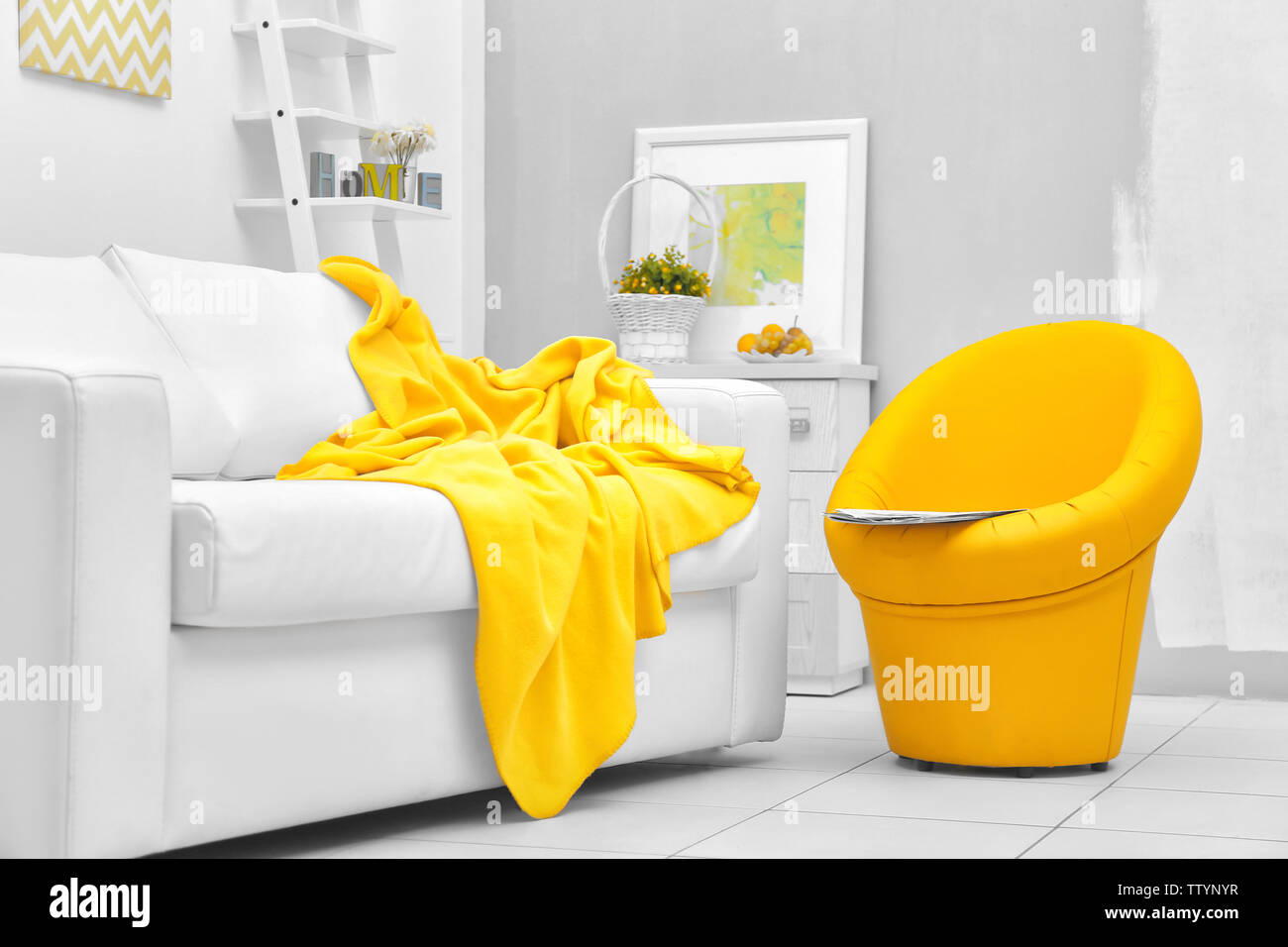 Modern living room with sofa and armchair Stock Photo - Alamy