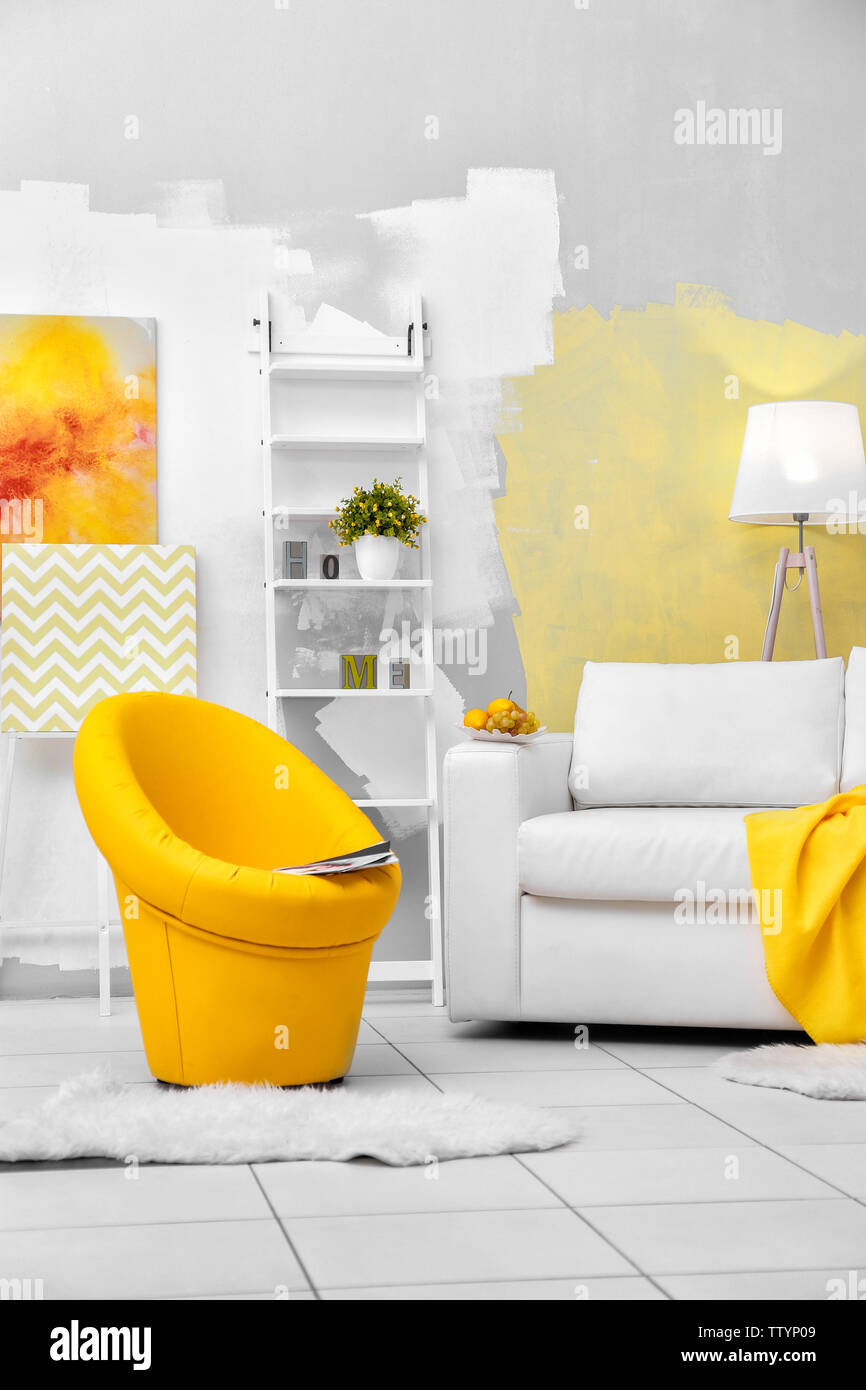 Modern living room with sofa and armchair Stock Photo - Alamy