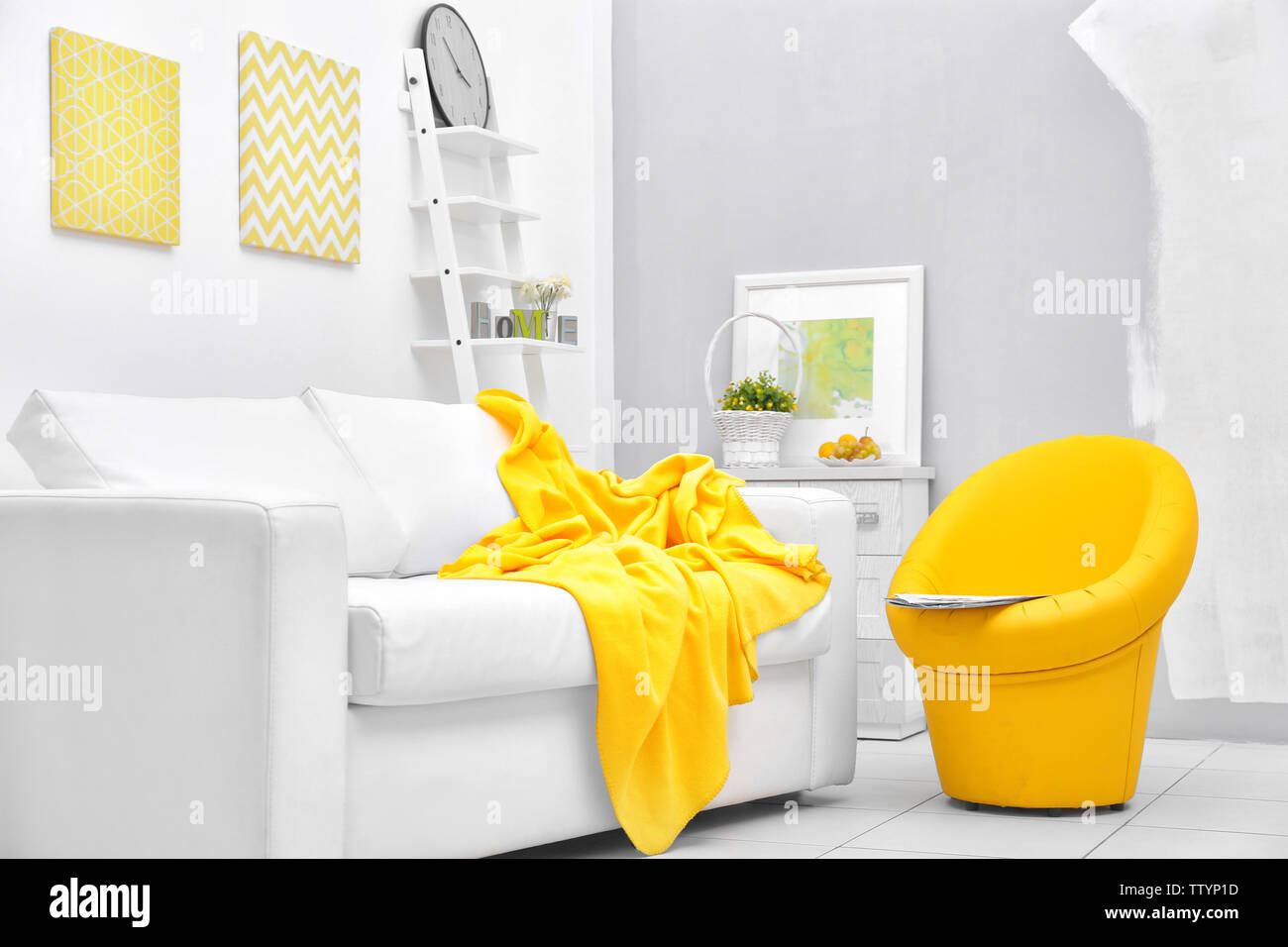 Modern living room with sofa and armchair Stock Photo - Alamy