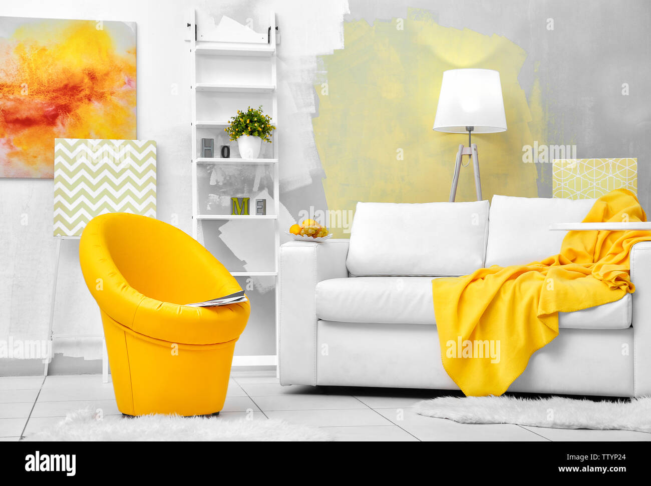 Modern living room with sofa and armchair Stock Photo - Alamy