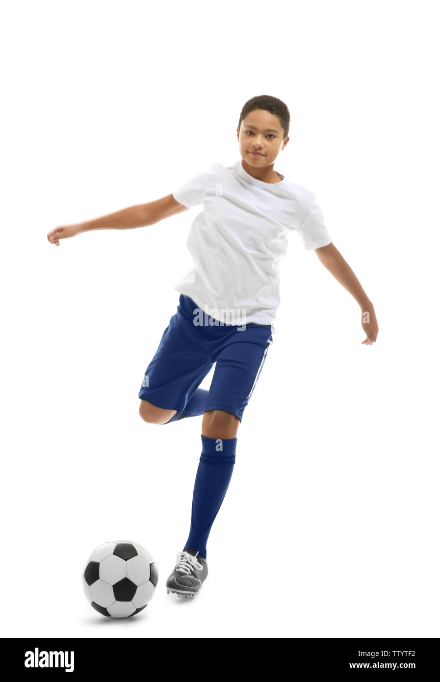 African American boy playing football on white background Stock Photo