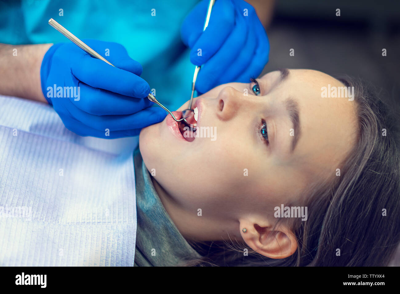 Dental clinic. Reception, examination of the patient. Teeth care. Young