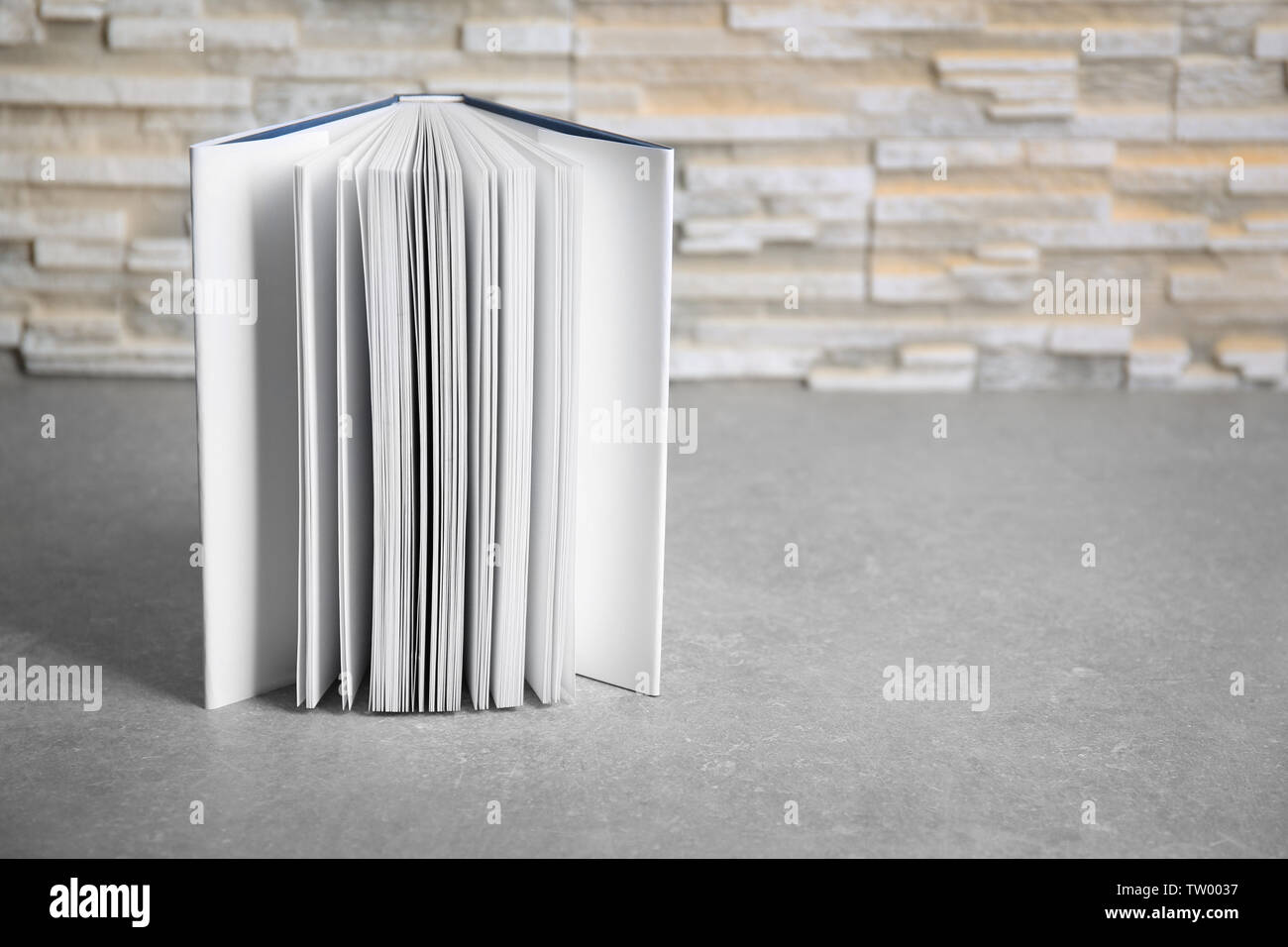 Open book on gray table Stock Photo