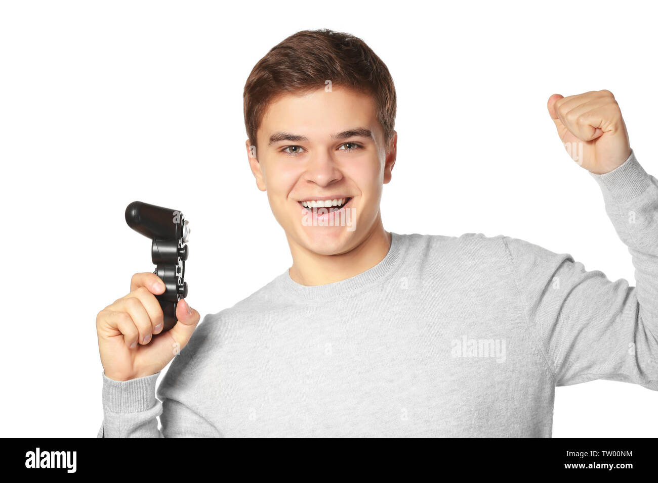 Teenager with game controller on white background Stock Photo