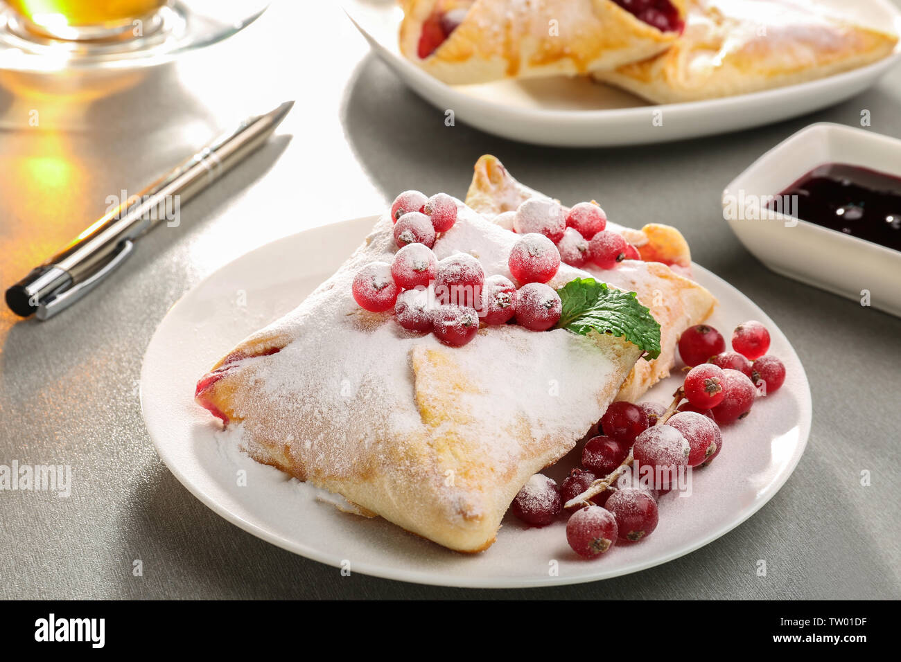 Tasty puff pastry with berries on plate Stock Photo - Alamy