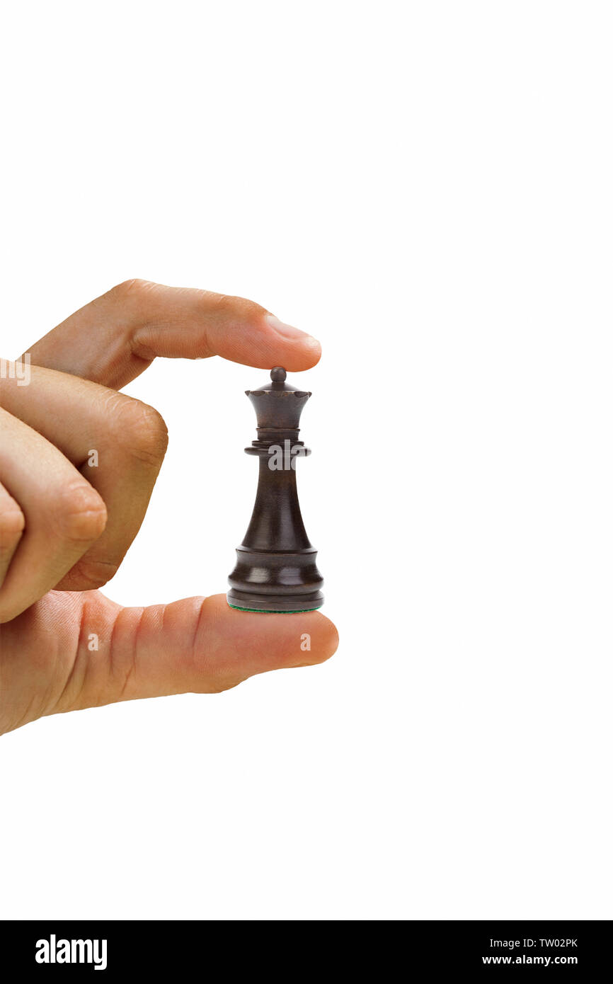 Close up of a man showing a chess piece Stock Photo
