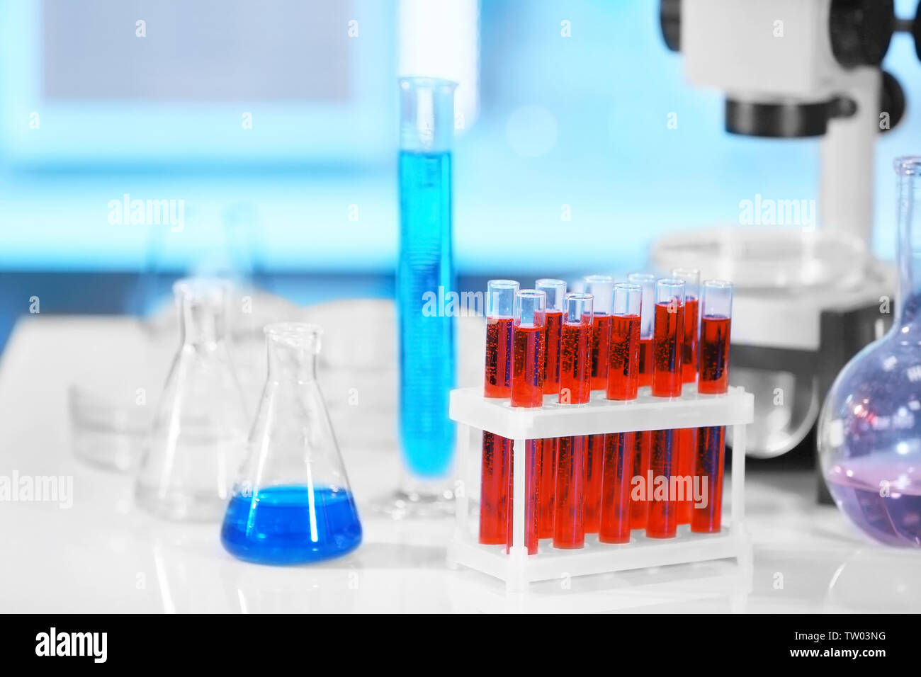 Test tubes with blood in laboratory on table Stock Photo - Alamy