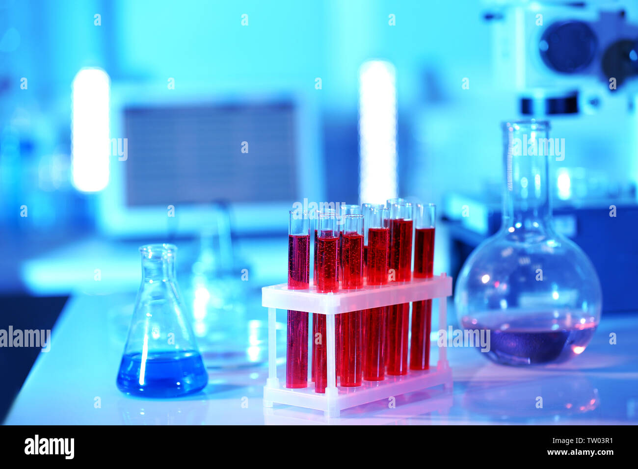 Test tubes with blood in laboratory on table Stock Photo - Alamy