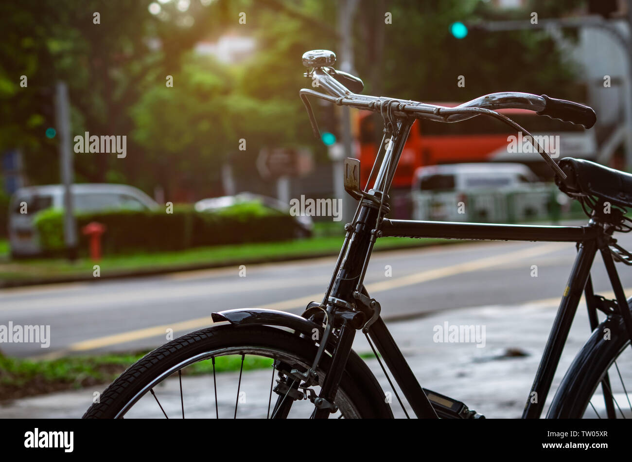 Bicycle parked near street for rent. Bike tour in Singapore city. Eco-friendly transport and healthy lifestyle concept. Outdoor activity. Bicycle for Stock Photo