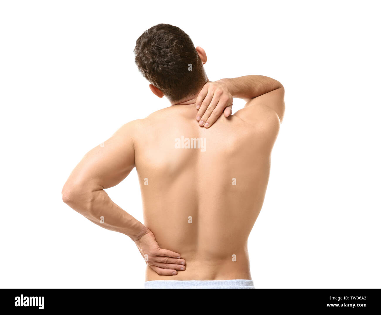 Young man suffering from backache on white background Stock Photo