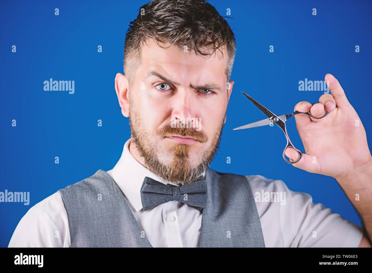 Businessman strict face hold scissors. Barber with beard and mustache hold steel scissors. Grooming beard. Create your style. Macho bearded barber hold scissors cut hair. Barbershop service concept Stock Photo - Alamy Businessman strict face hold scissors. Barber with beard and mustache hold steel scissors. Grooming beard. Create your style. Macho bearded barber hold scissors cut hair. Barbershop service concept Stock Photo - Alamy