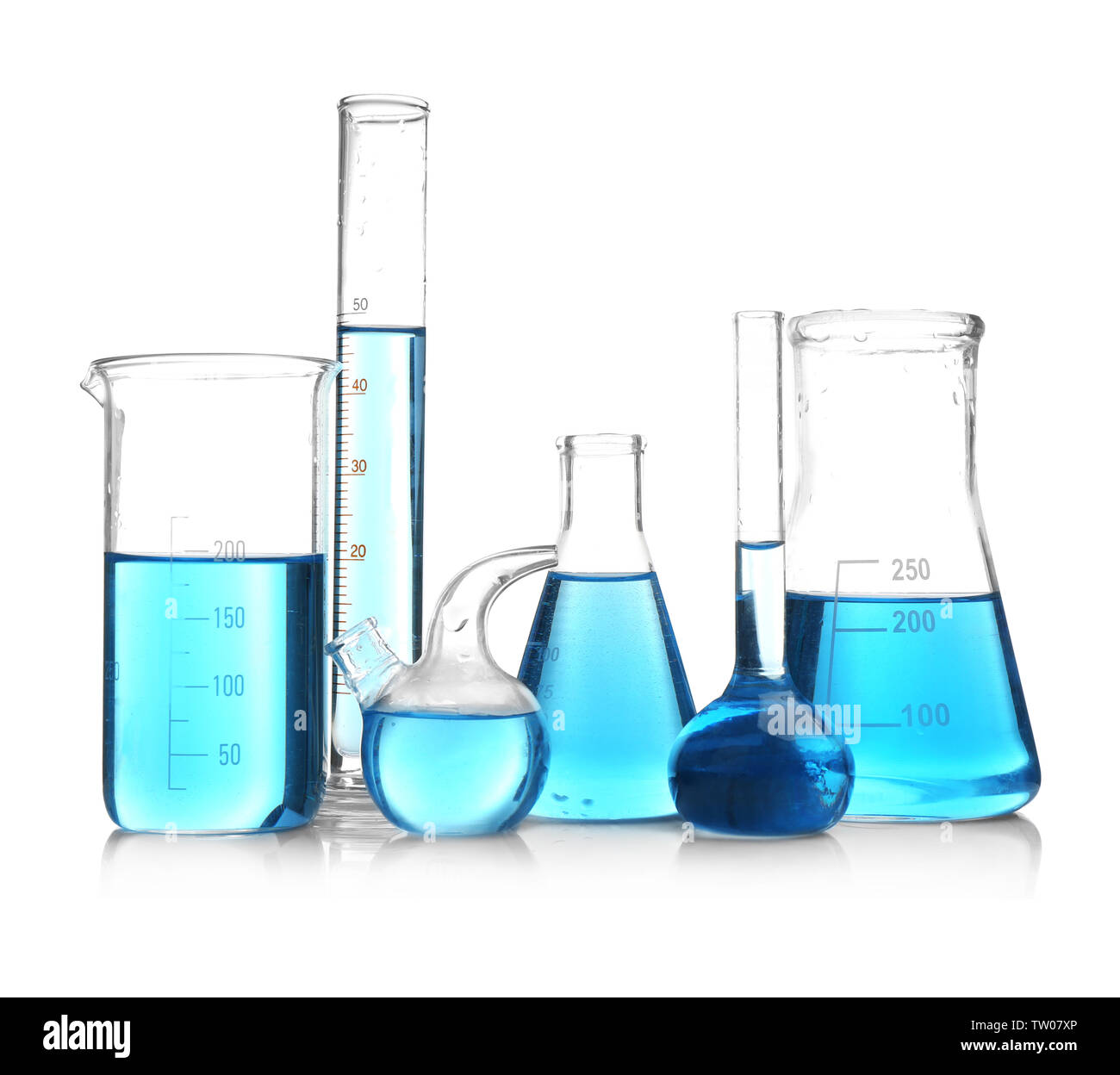 Laboratory glassware with blue samples on white background Stock Photo ...