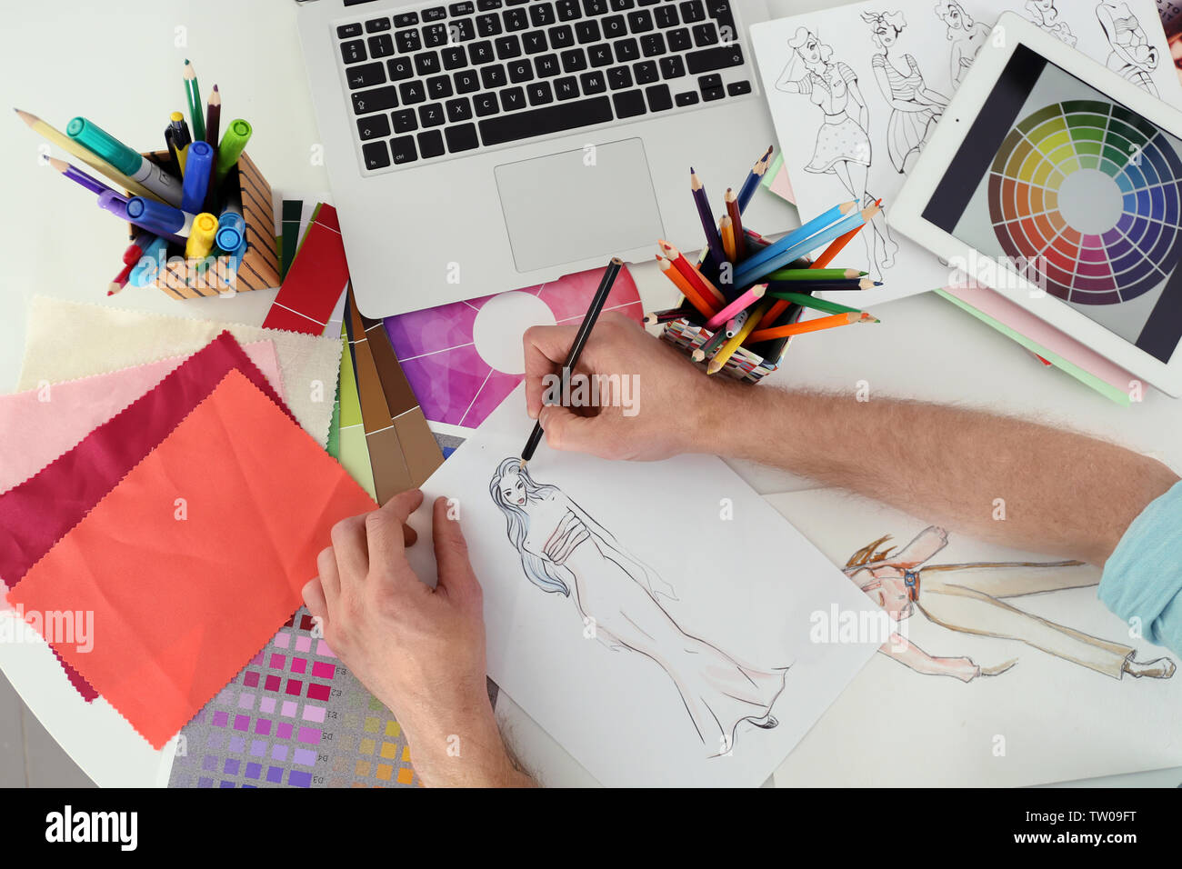 Closeup of fashion designer drawing at office Stock Photo - Alamy