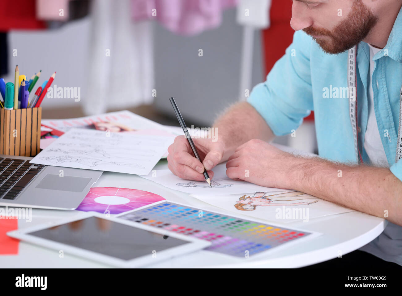 Closeup of fashion designer drawing at office Stock Photo - Alamy