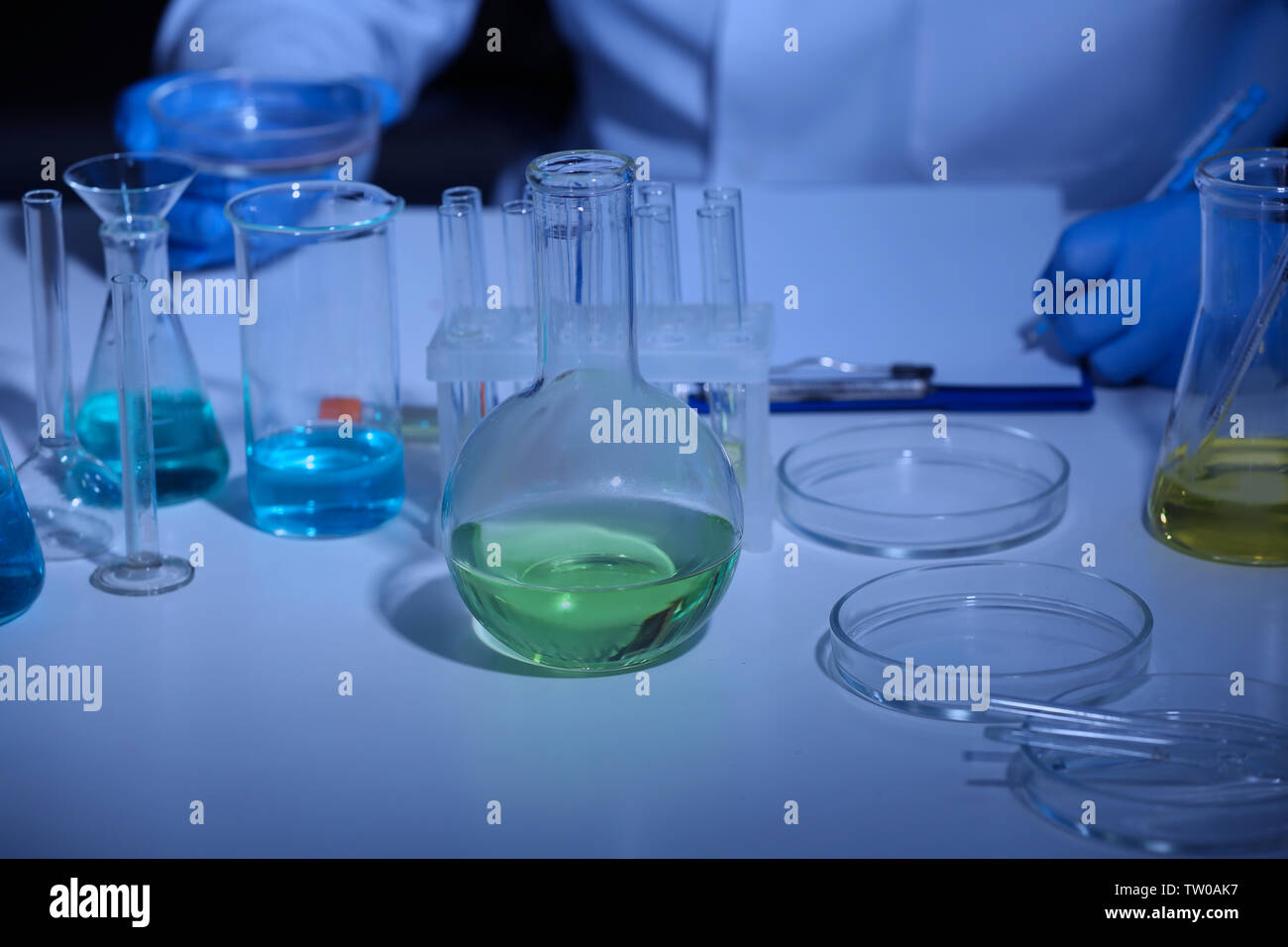 Test tubes and flasks with samples in laboratory Stock Photo - Alamy