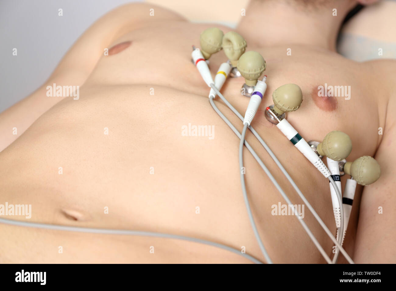 Making ECG for young man in modern clinic, closeup Stock Photo - Alamy 