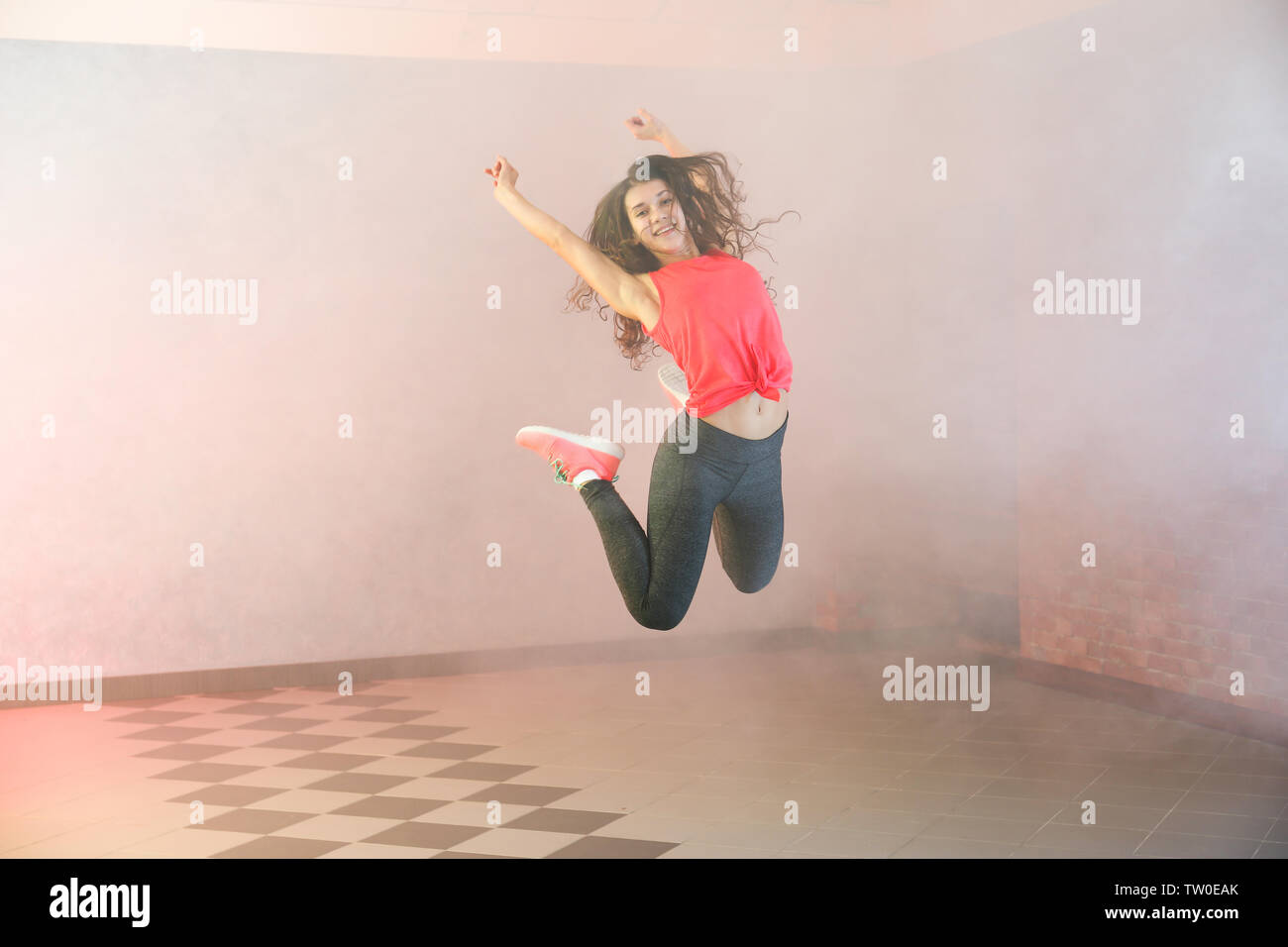 Beautiful young hip-hop dancer in studio Stock Photo - Alamy