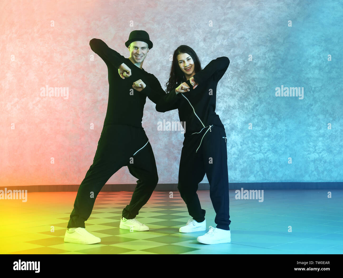 Couple of young hip-hop dancers in studio Stock Photo - Alamy