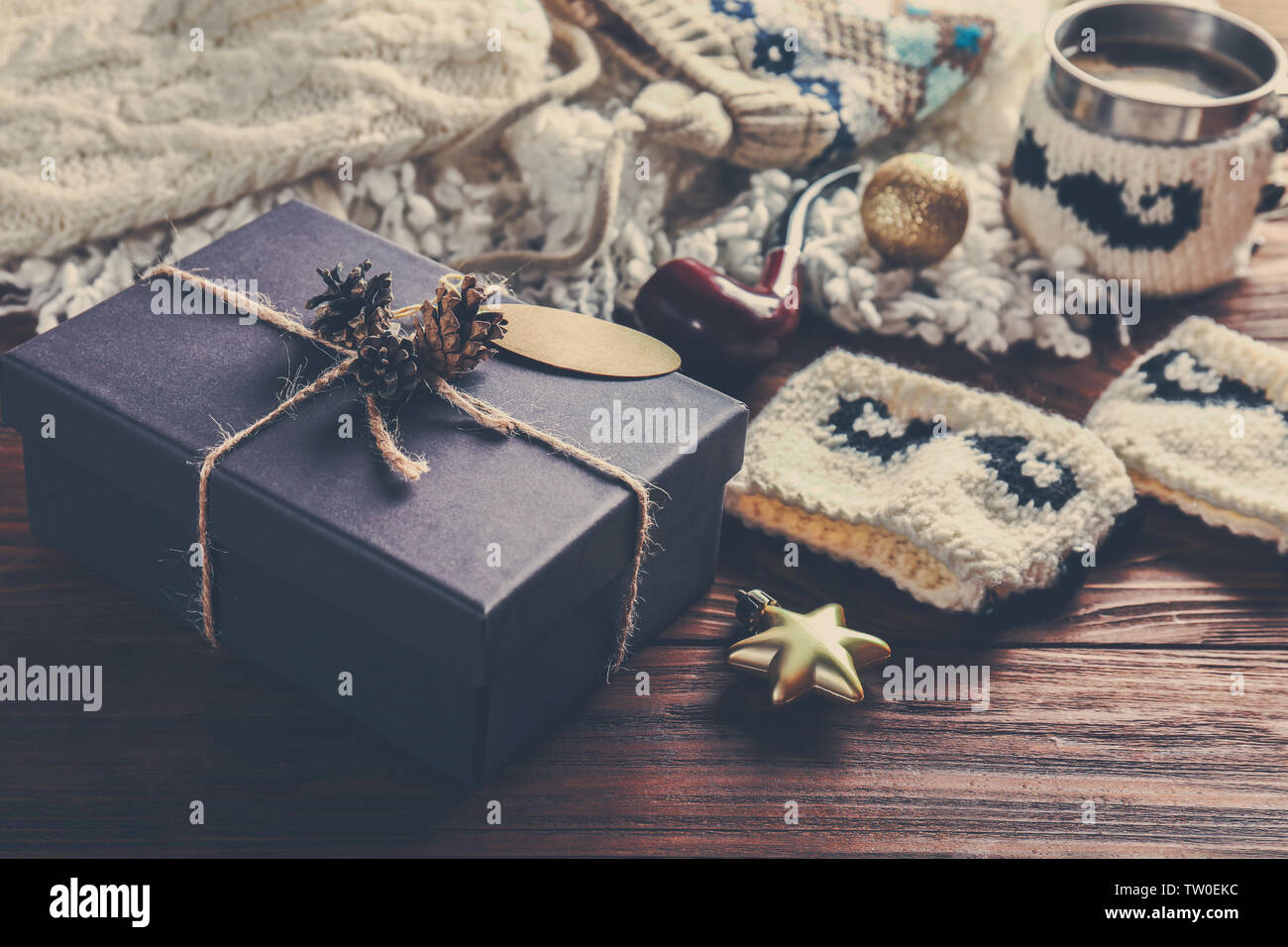 Gift box and Christmas decorations on wooden background Stock Photo