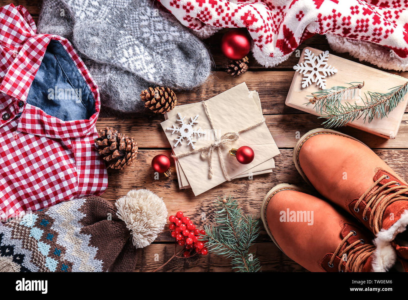 Christmas decorations and clothes on wooden background Stock Photo Alamy