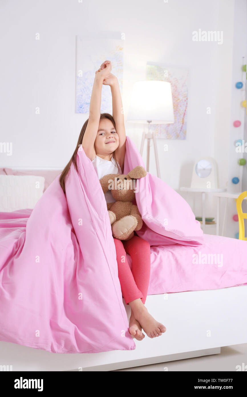 Cute little girl waking up in morning Stock Photo