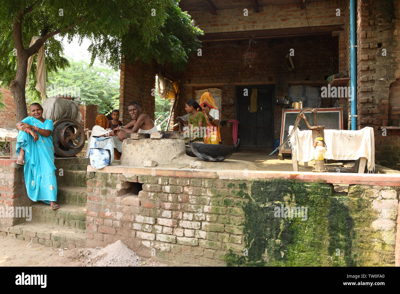 Family sitting at a house, India Stock Photo