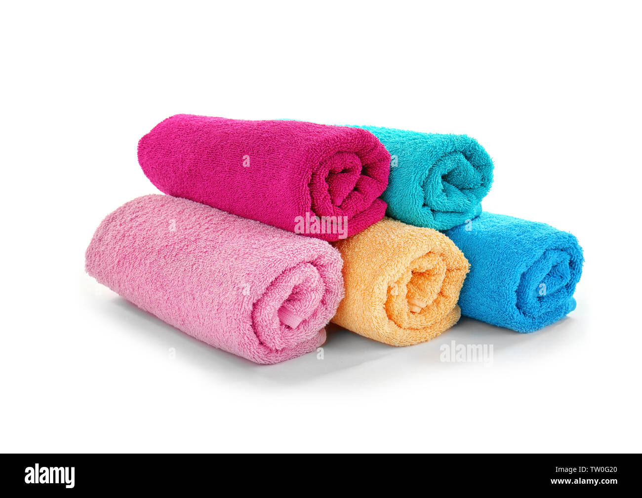 Pile of rolled towels isolated on white Stock Photo