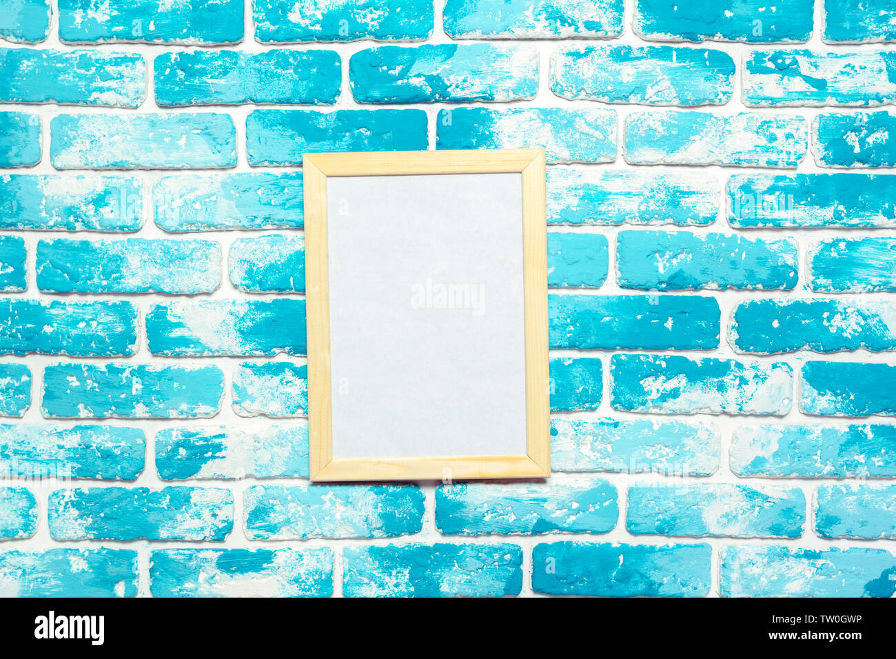 Picture frame on brick wall Stock Photo - Alamy