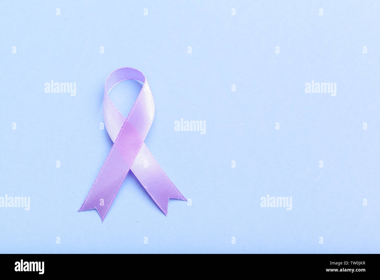 ribbon HIV, AIDS on blue background Stock Photo - Alamy