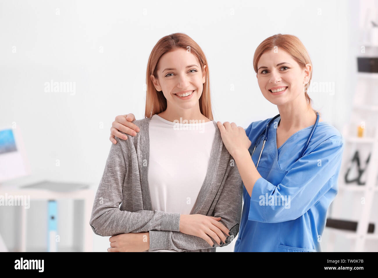 Young female doctor hug hi-res stock photography and images - Alamy