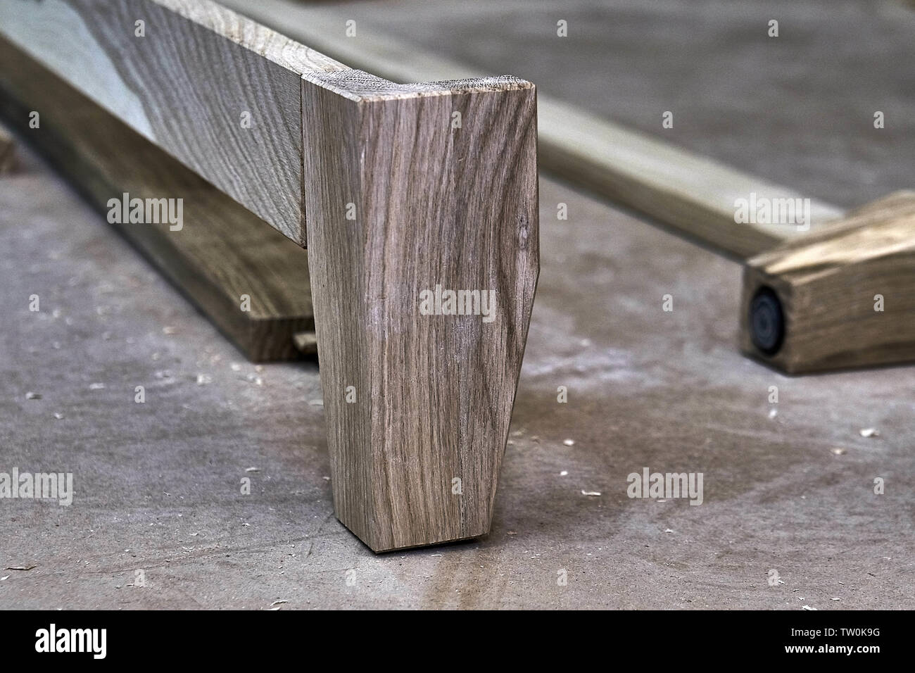 Furniture legs from solid oak. Closeup. Wooden furniture manufacturing