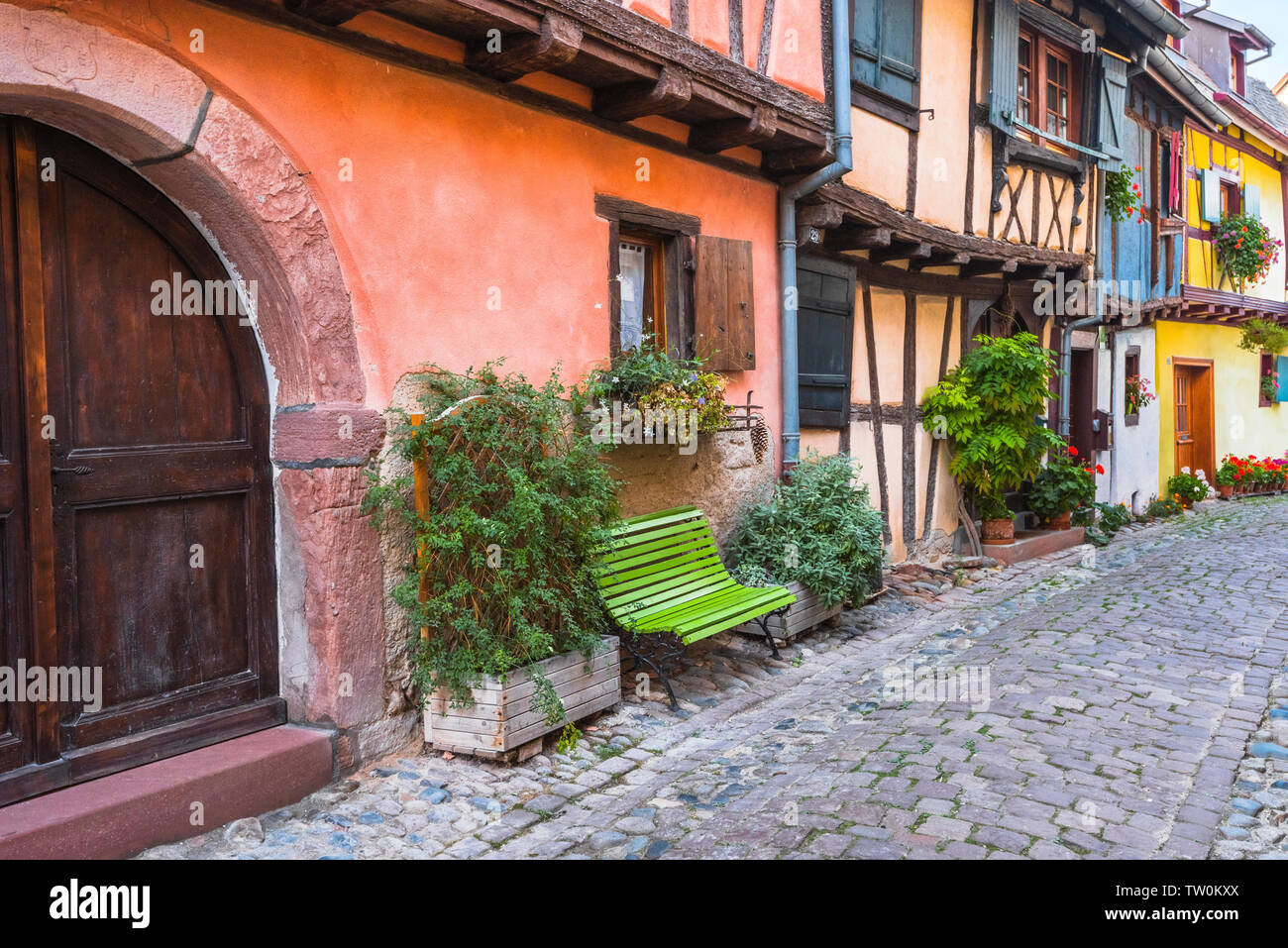 old colorful houses of Eguisheim, Alsace, France, timber frame architecture over the lane Stock Photo