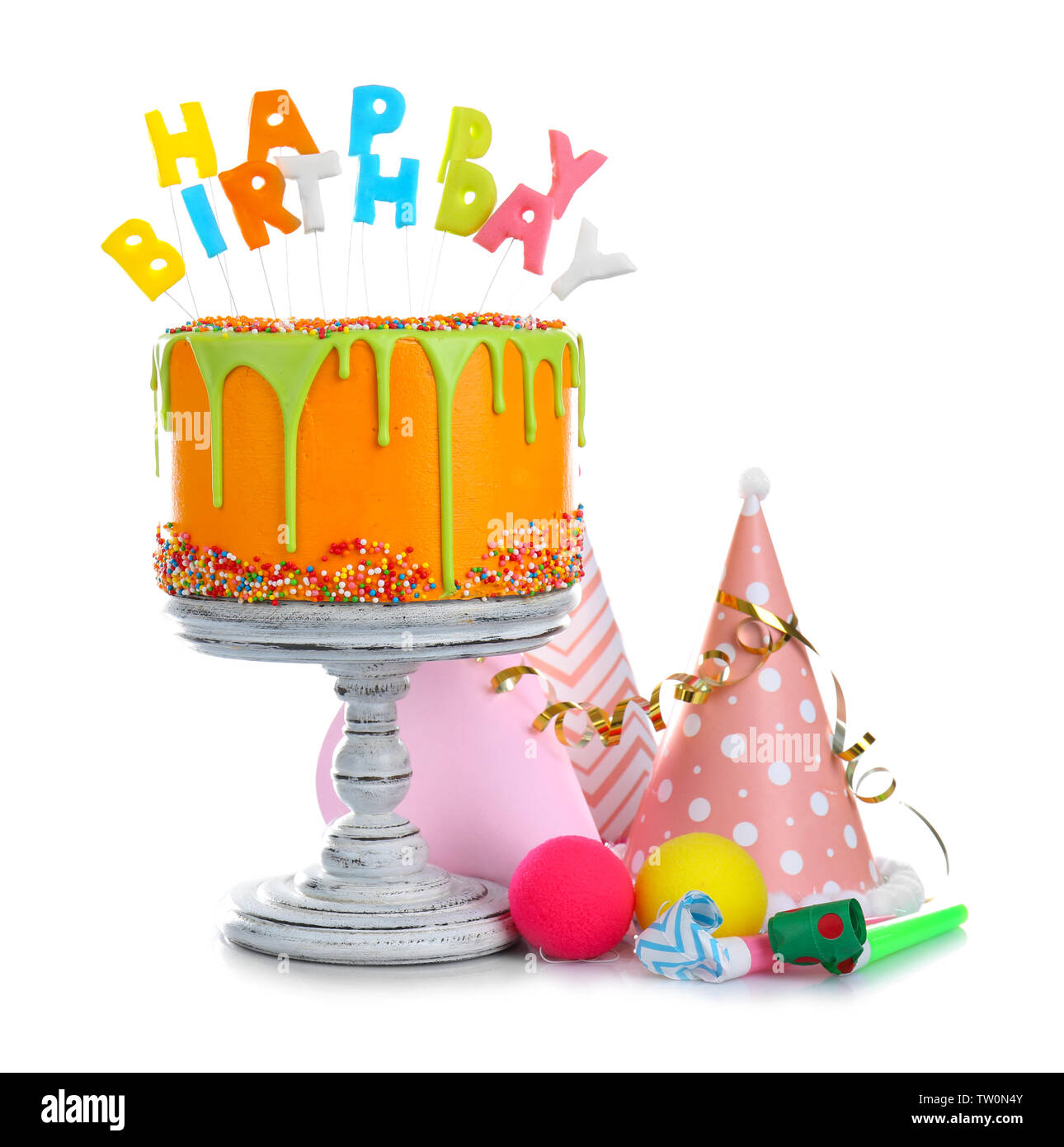 Delicious cake with happy birthday lettershaped candles isolated on