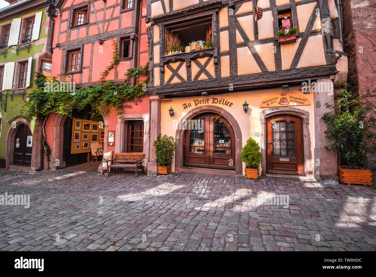 old timbered houses with carvings in the village Riquewihr, Alsace, France, typic Alsatian tourist destination Stock Photo