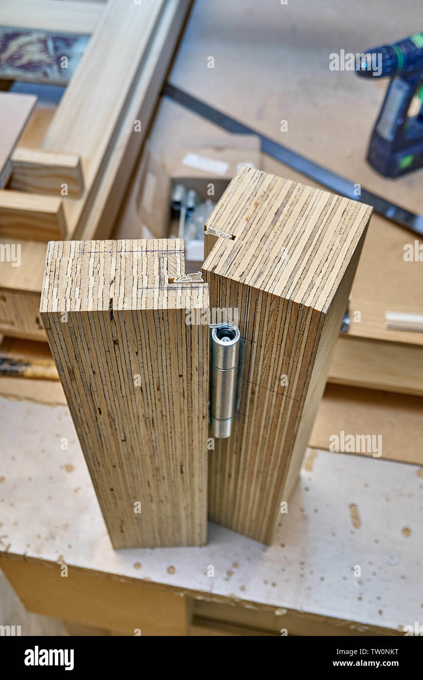 Wood door manufacturing process. Door hinge installation. Woodworking