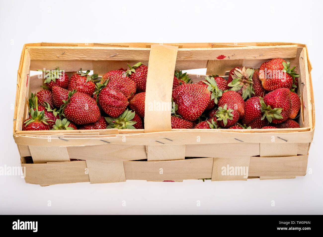 A basket full of ripe strawberries isolated on white background Stock ...