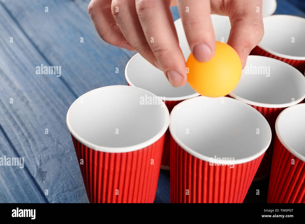 Download Yellow Ball In Male Hand And Paper Cups Arranged For Playing Beer Pong Stock Photo Alamy Yellowimages Mockups