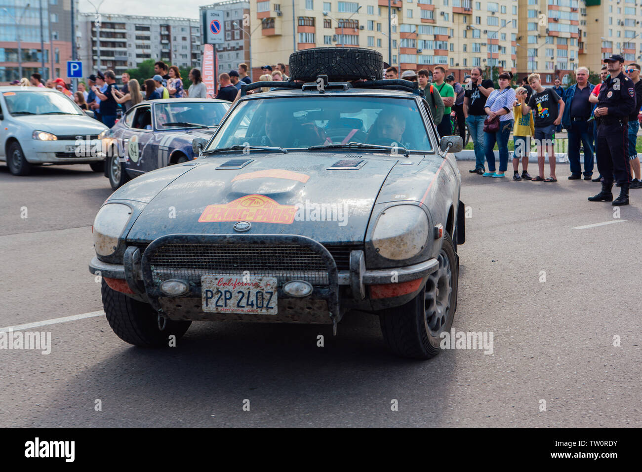 Novokuznetsk, Russia-June 14, 2019: The 7th Peking to Paris Motor Challenge 2019. Datsun 240Z 1972 leaving the city and going to another stage of Stock Photo