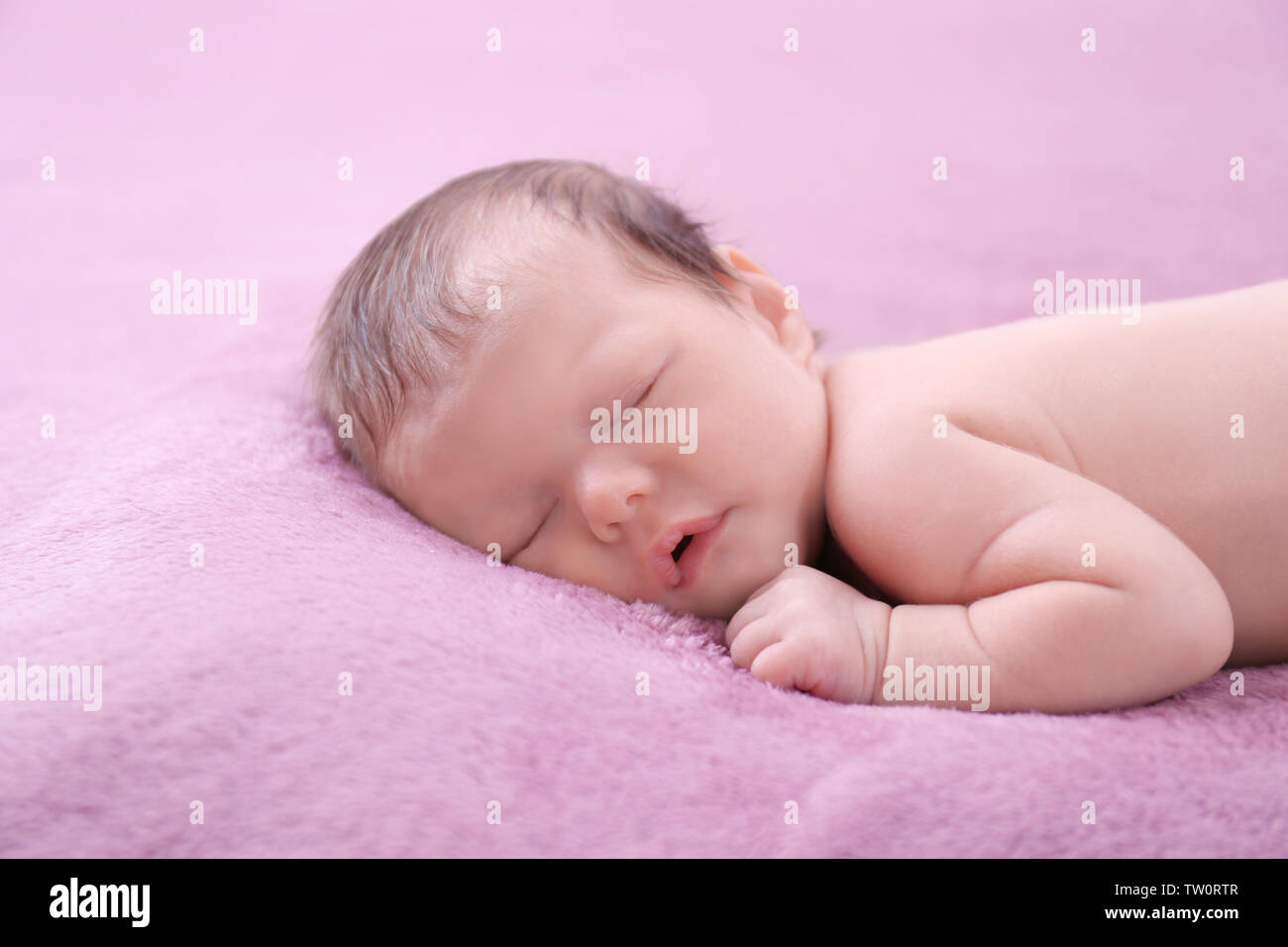 Cute little baby sleeping on bed at home Stock Photo Alamy