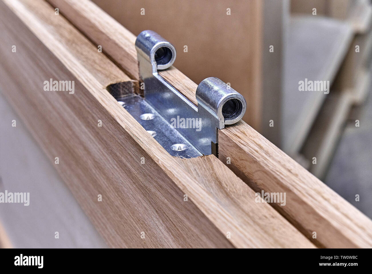 Wood door manufacturing process. Door leaf. Door hinge installation