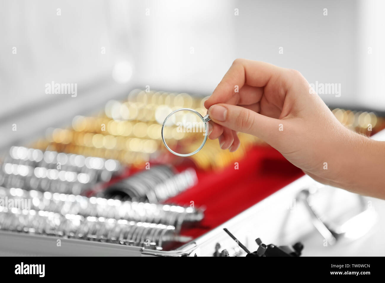 Doctor hand holding trial lens Stock Photo