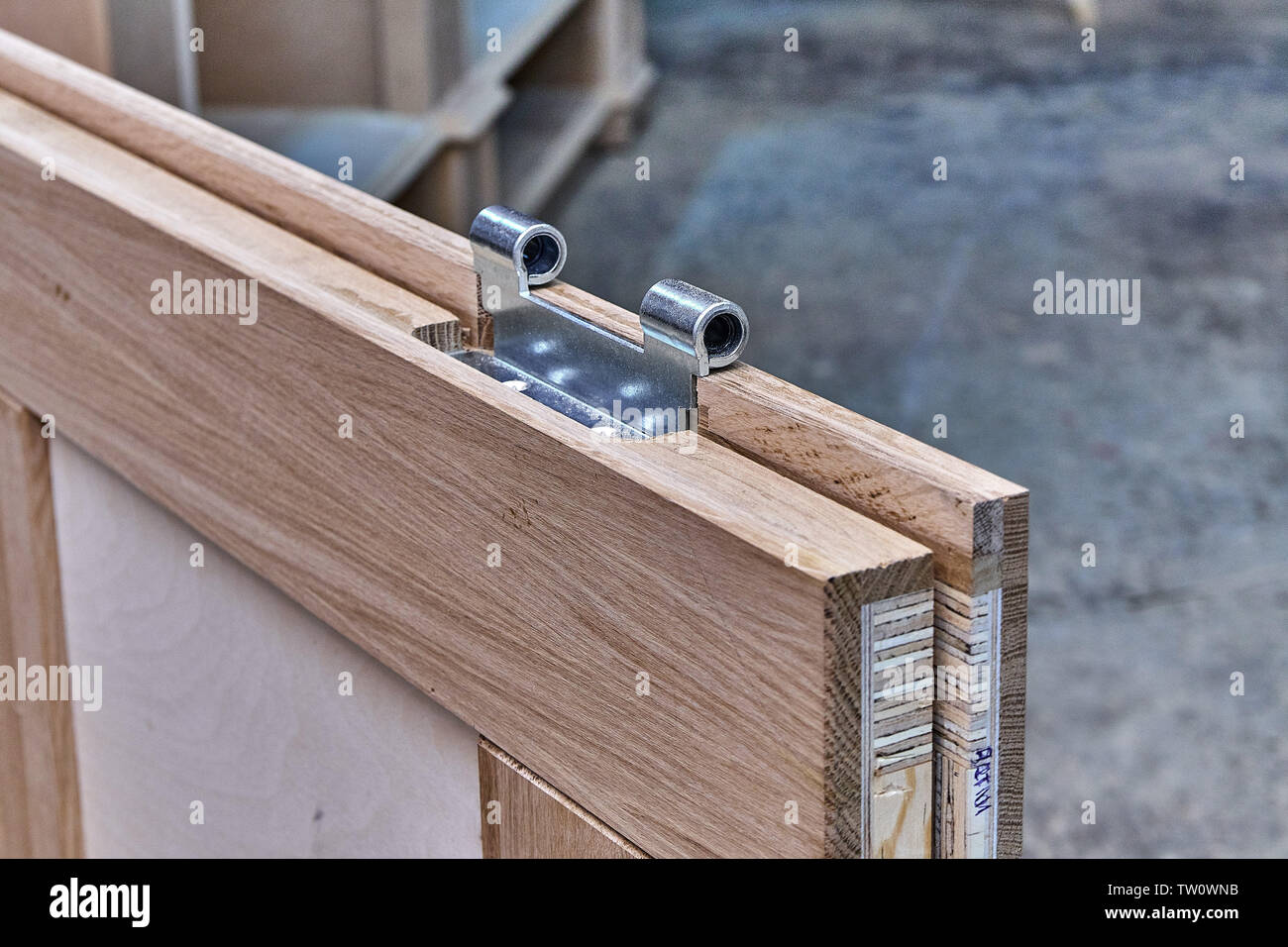 Wood door manufacturing process. Door leaf. Door hinge installation