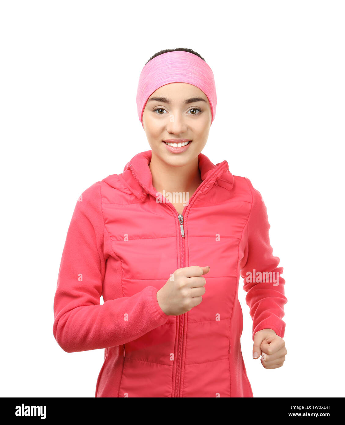 Young woman in sportswear running on white background Stock Photo - Alamy