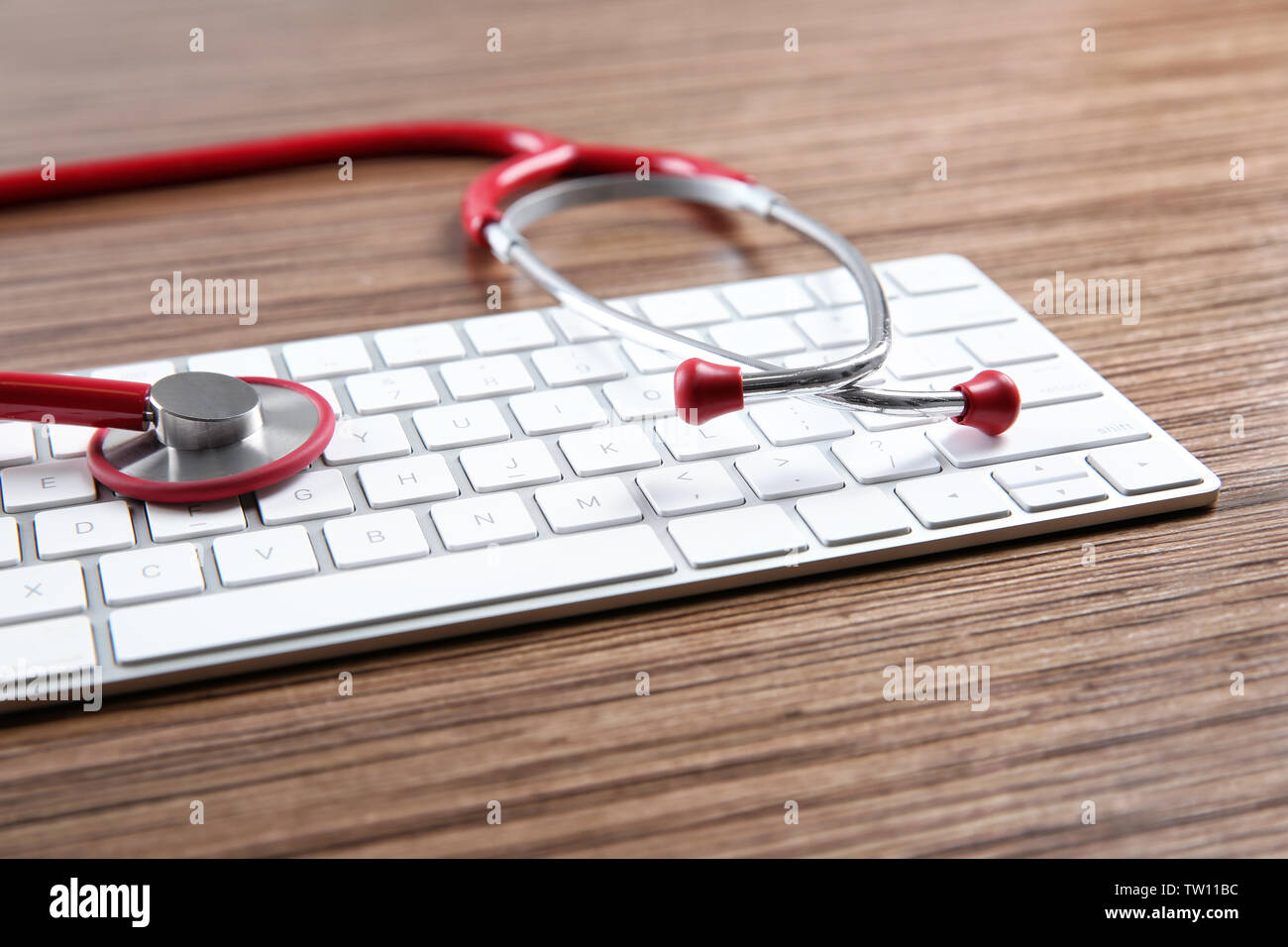 Stethoscope on computer keyboard, closeup Stock Photo - Alamy