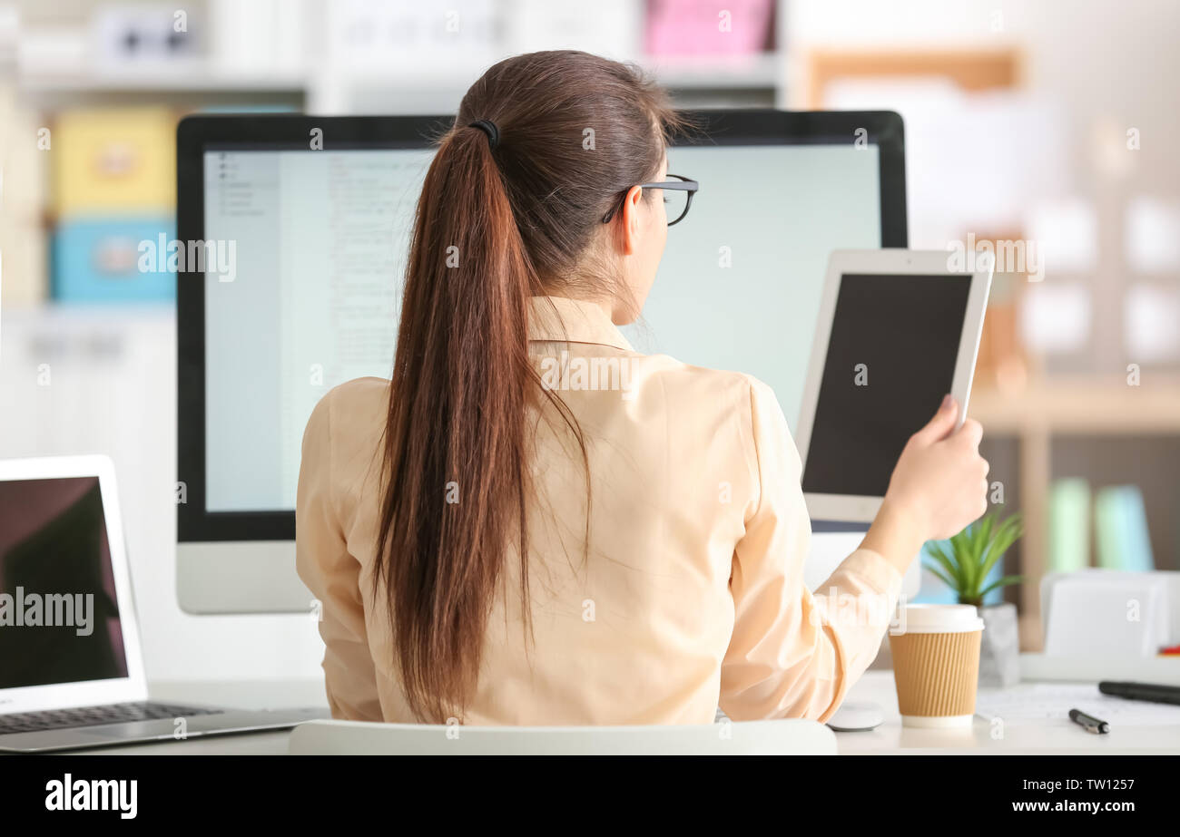 Woman programmer working at office Stock Photo